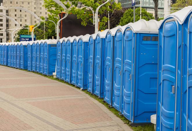 a fleet of portable restrooms ready for use at a large outdoor wedding or celebration in Delray Beach